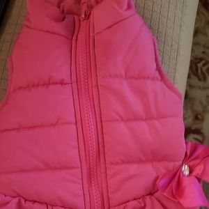 Pink zip up jacket for a dog